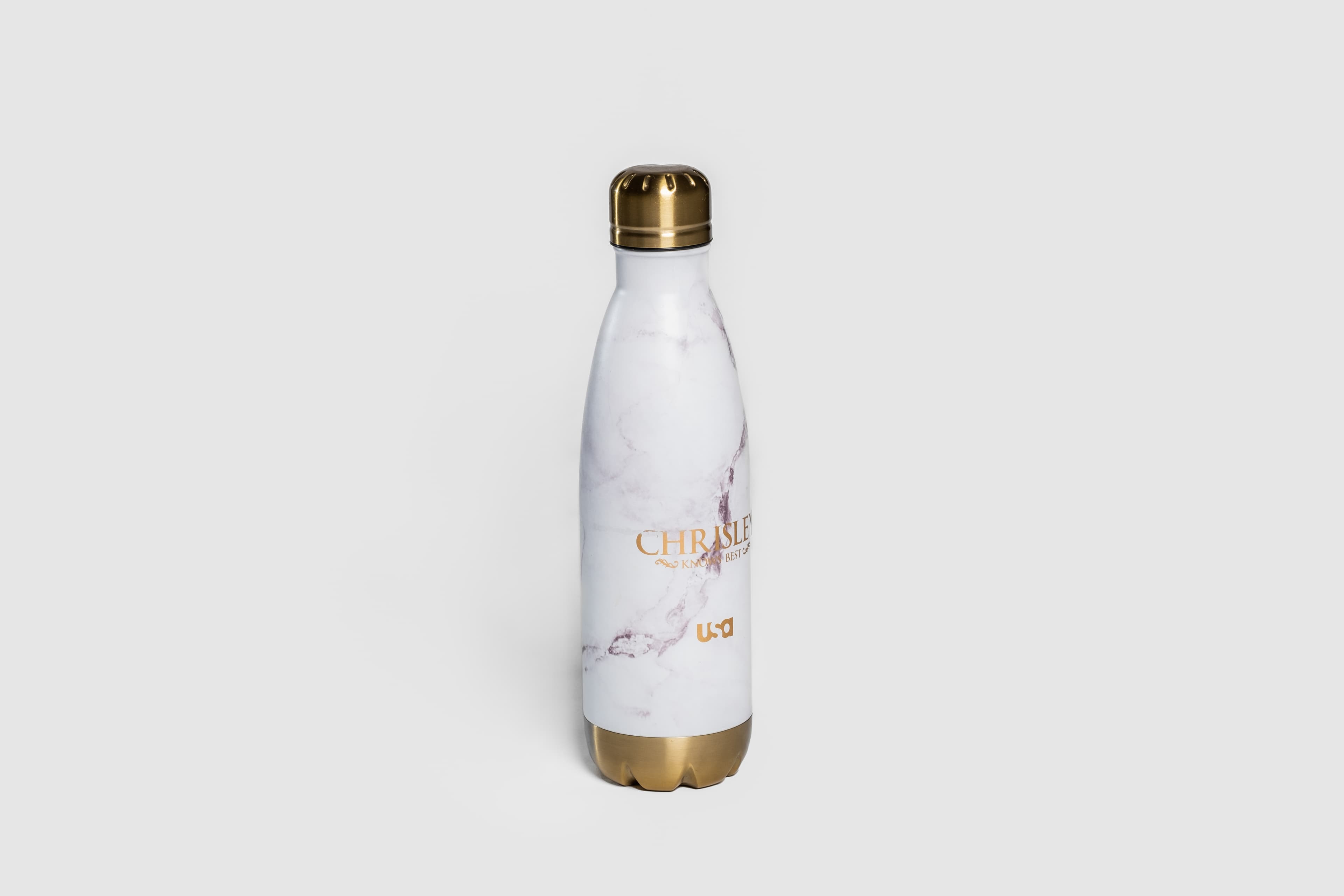 A photo of the back of a 'Chrisley Knows Best' water bottle, taken at an angle