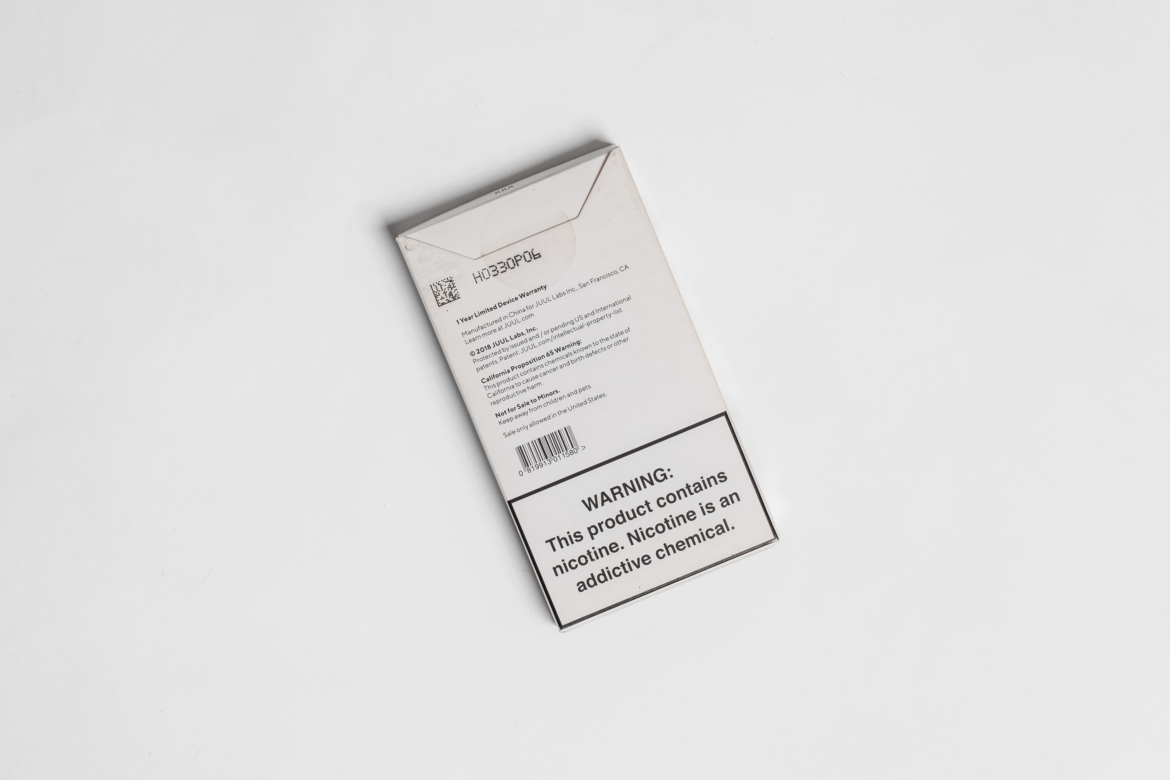 JUUL device, back angled view