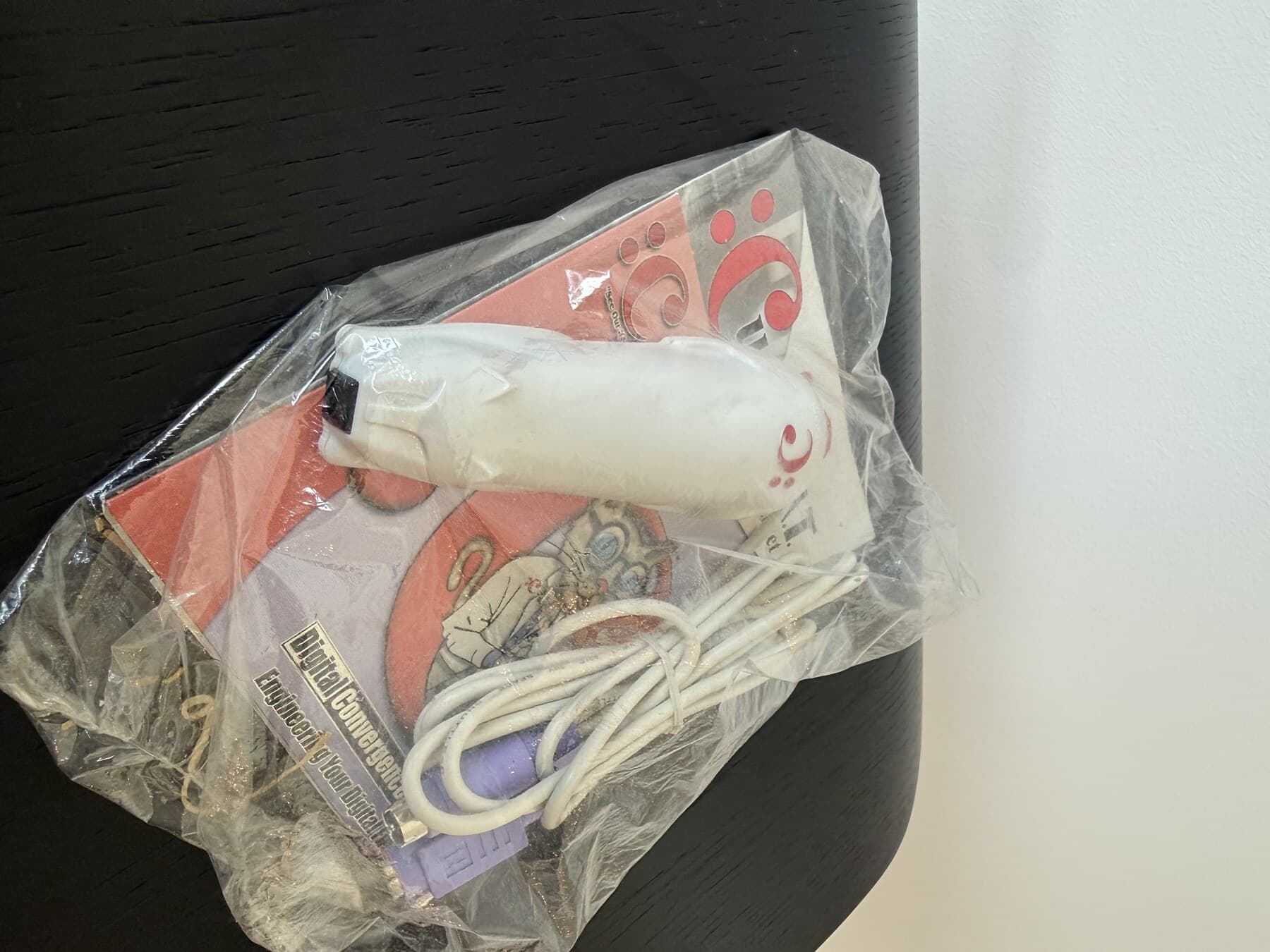 CueCat barcode scanner in its packaging