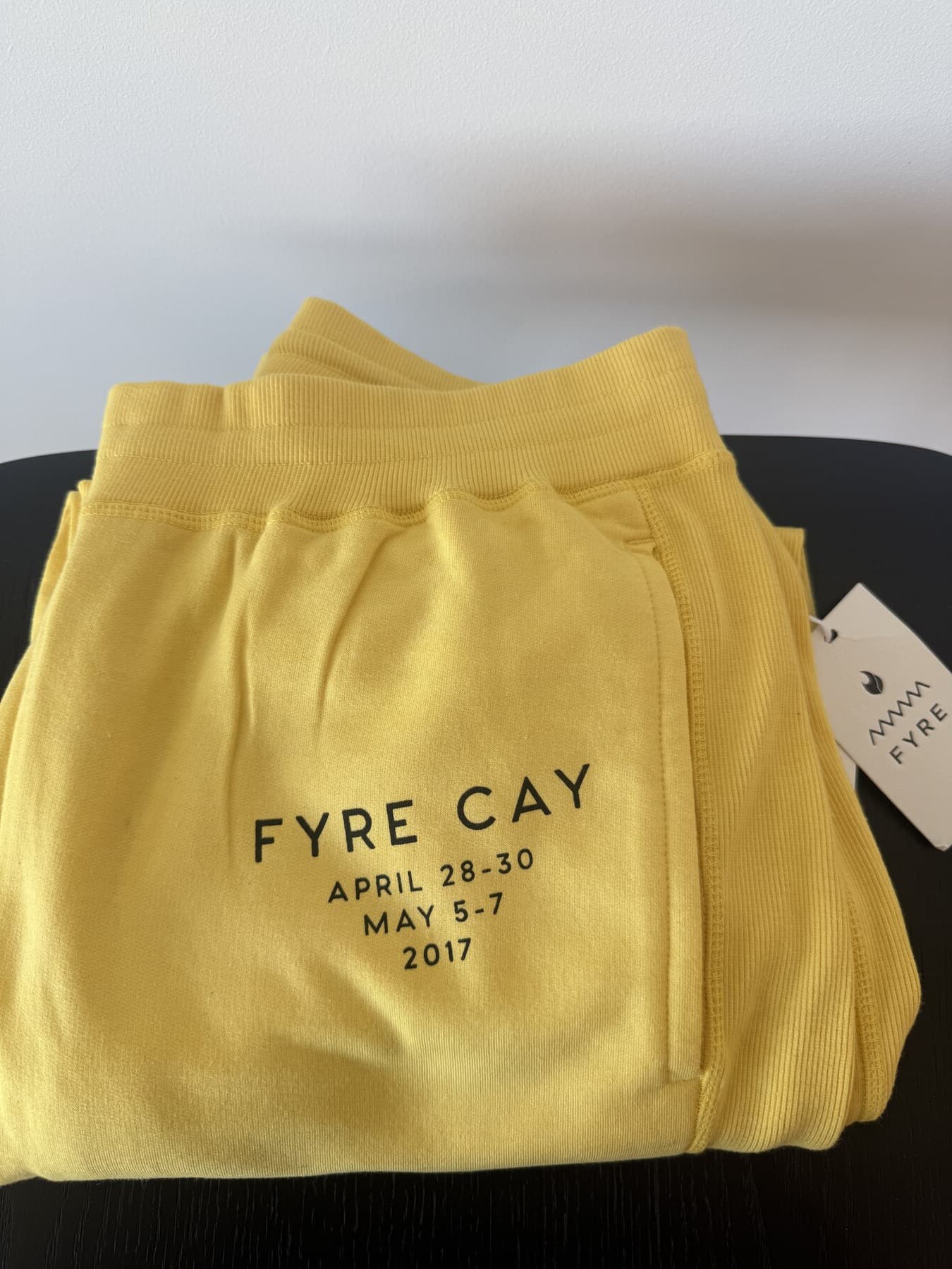 Folded pair of Fyre Fest sweatpants