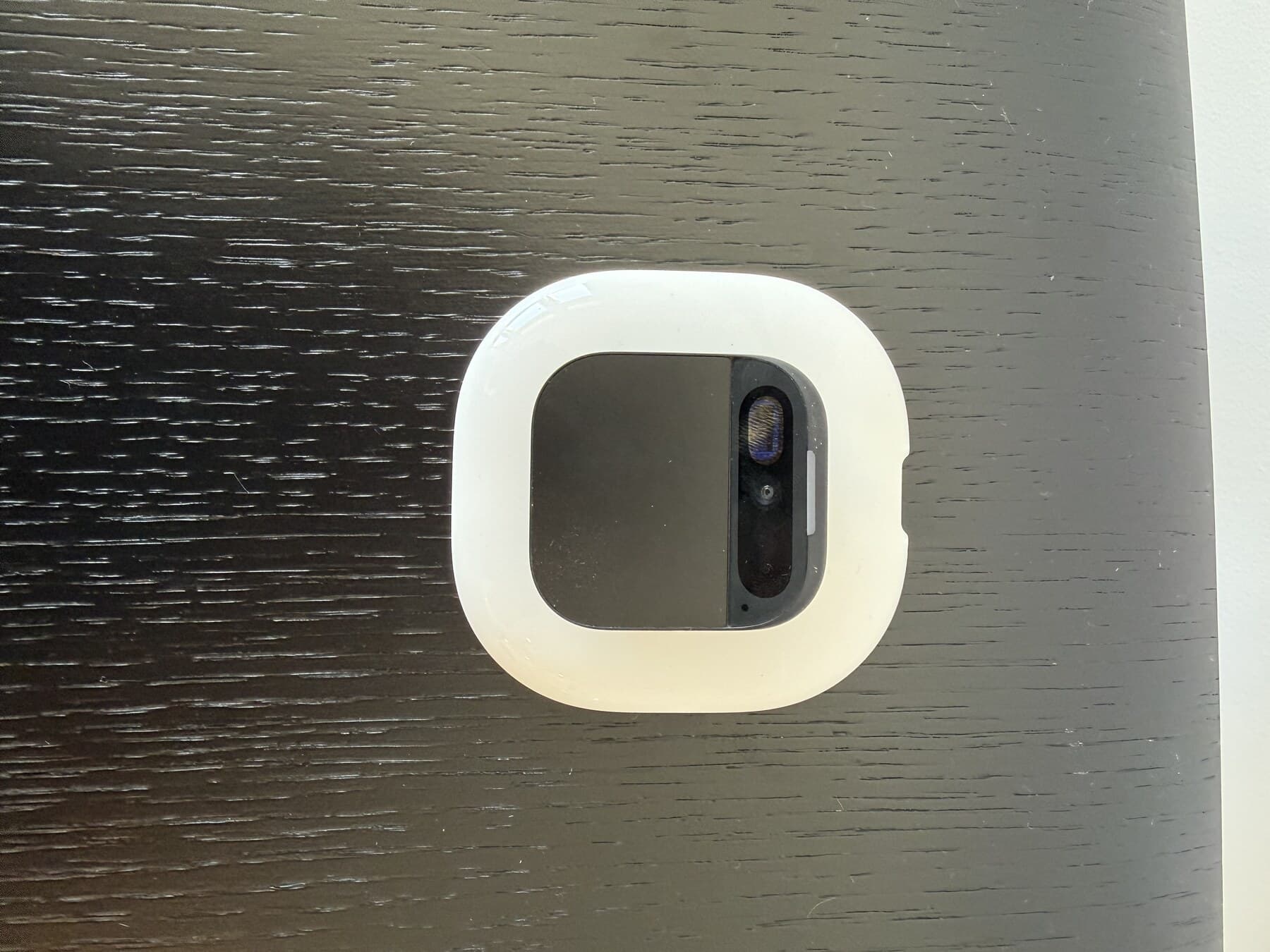 Humane AI pin on its charging dock