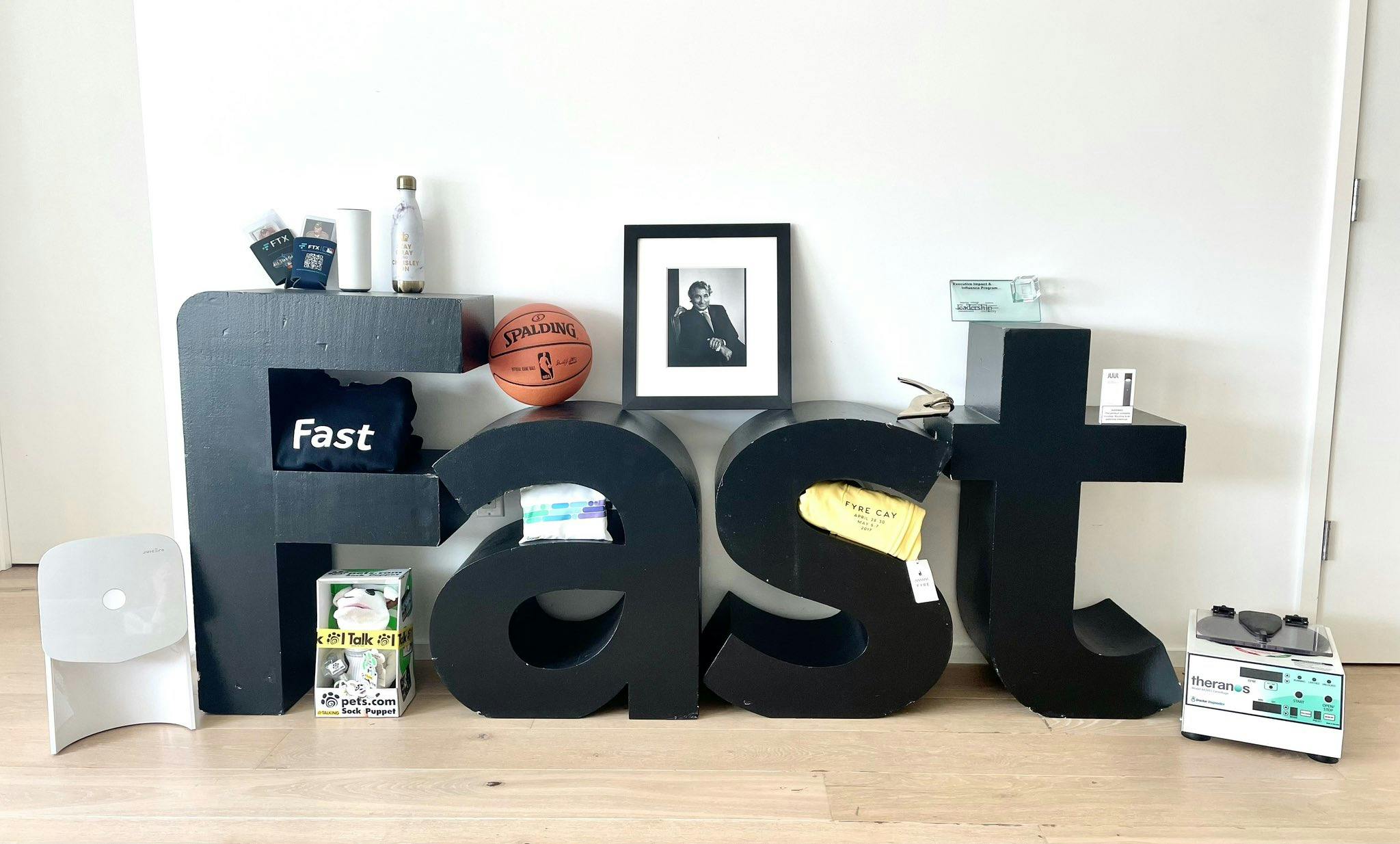 A photograph of several items in the collection arranged around large FAST letters.